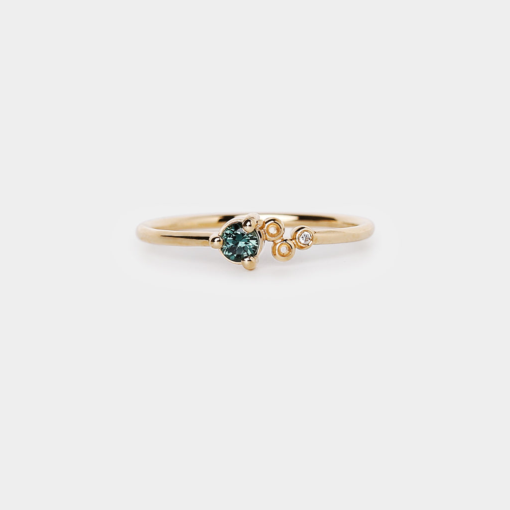 petite meteor crater teal sapphire ring