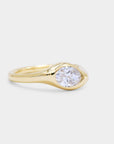 Sculpture curvy gold signet ring with a oval diamond
