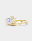 Oval diamond in a curvy sculpture smooth gold band. Dune - oval lab diamond