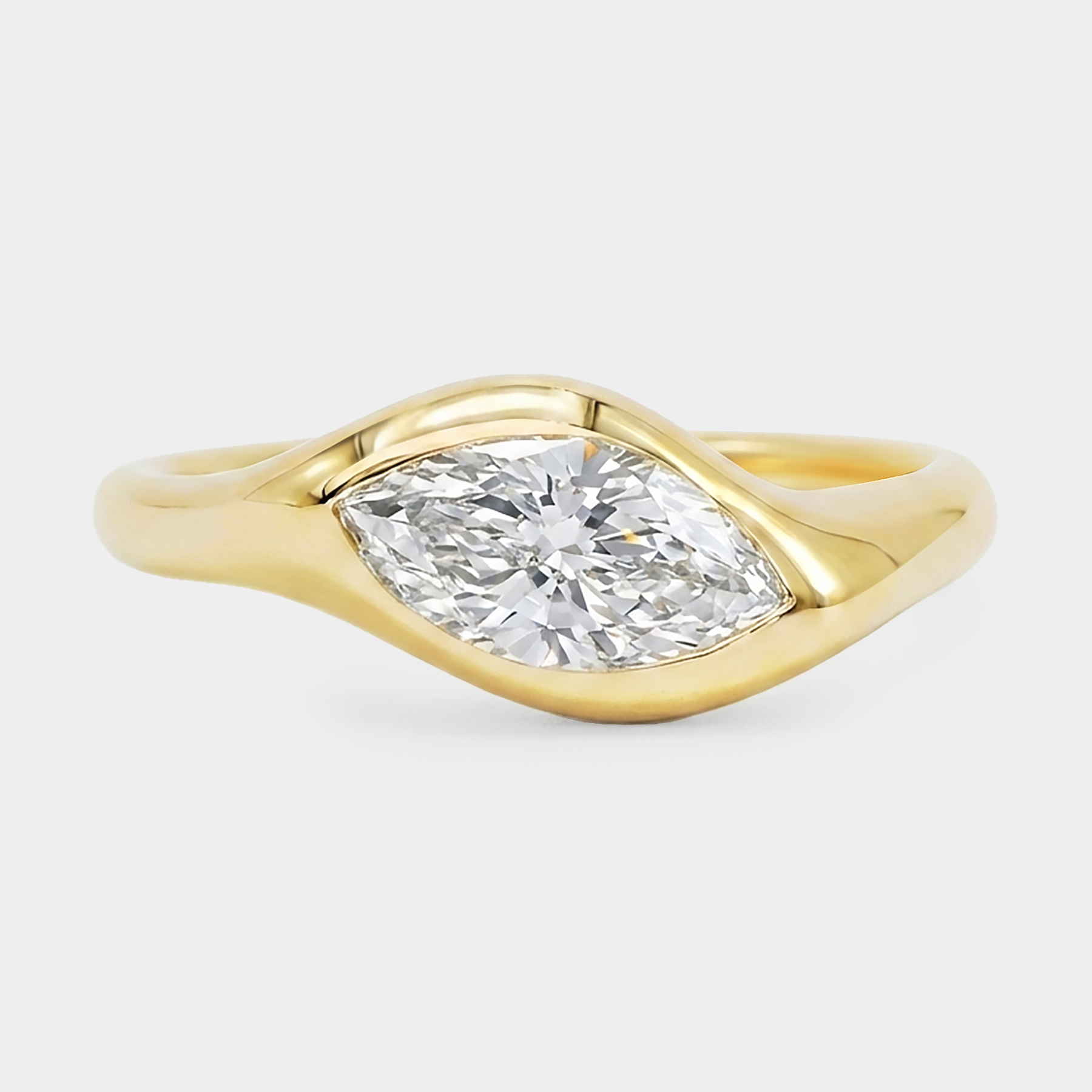 Sculpture curvy gold signet ring with a marquise diamond