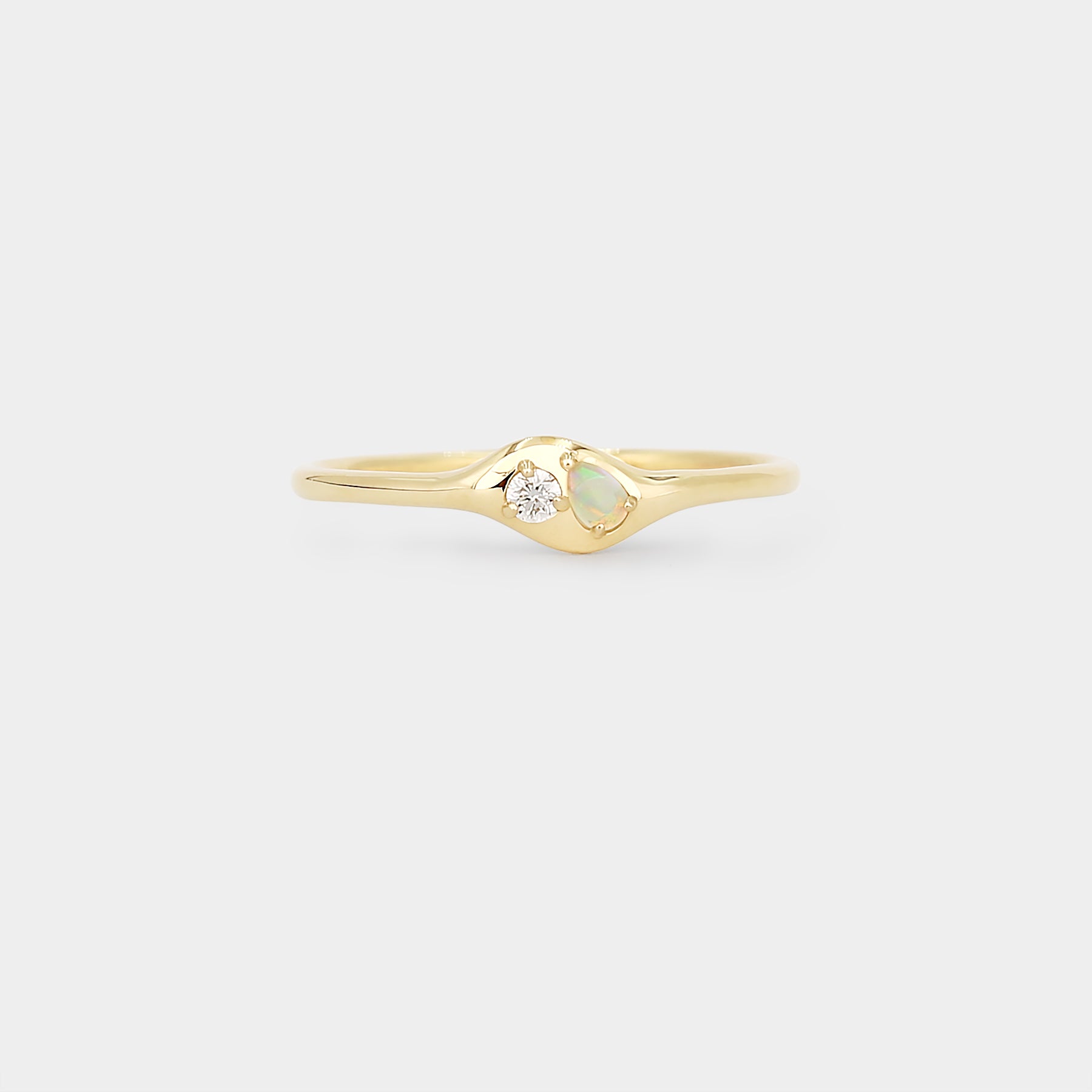 Gold ring with a pear Australian opal and diamond for every day wearing