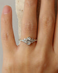 Cluster oval diamond ring on hand - James and Irisa